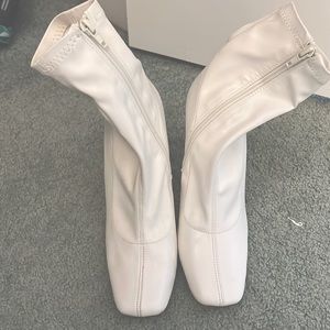 White leather ankle booties